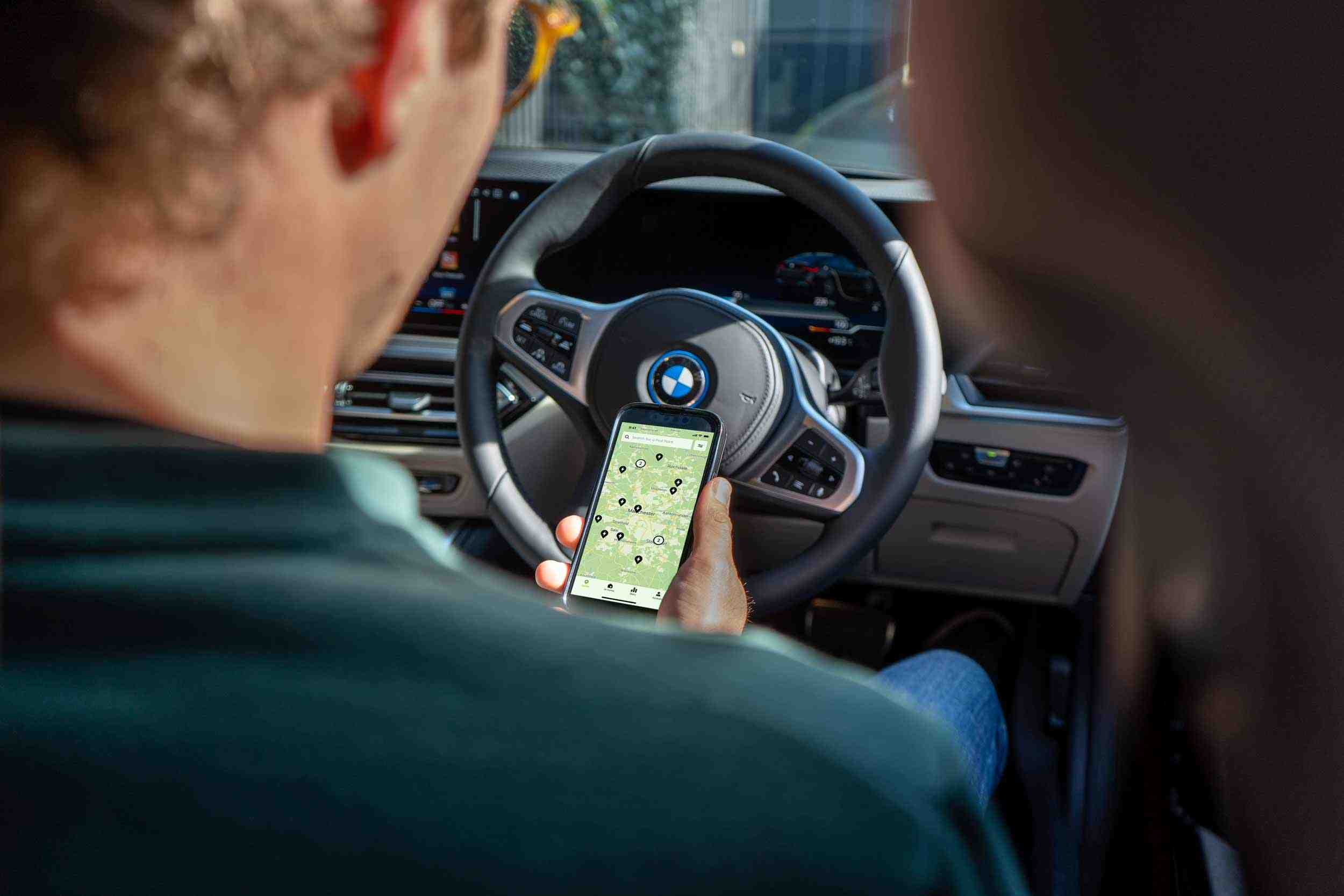 Pod Point App screenshot with BMW steering wheel