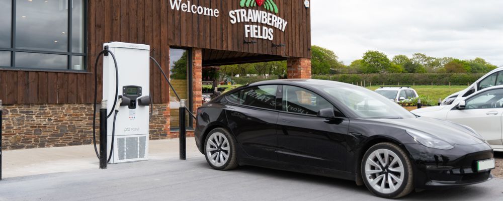 Tesla car charging on a rapid charger in public