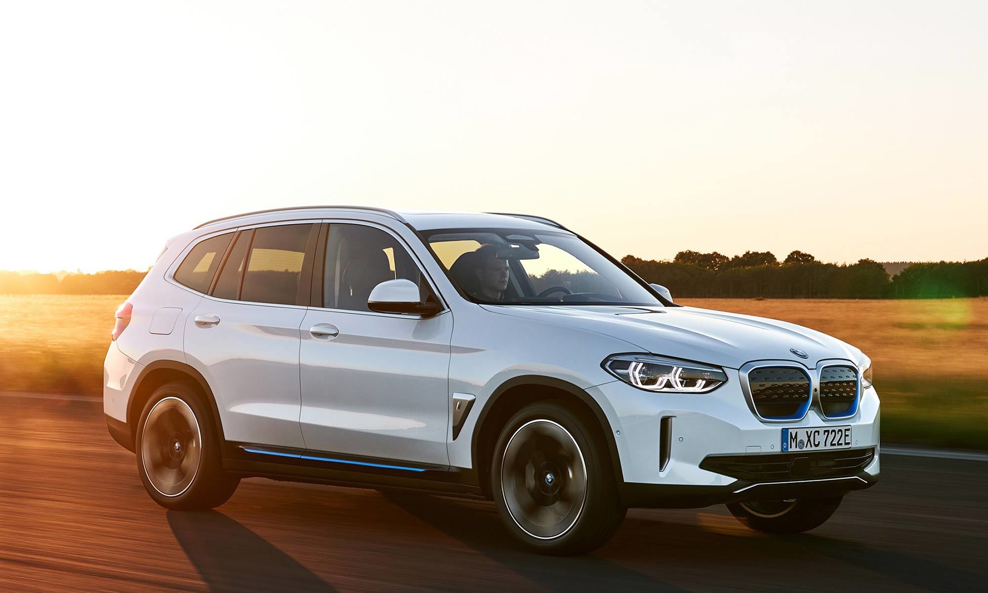 bmw ix parked at sunset